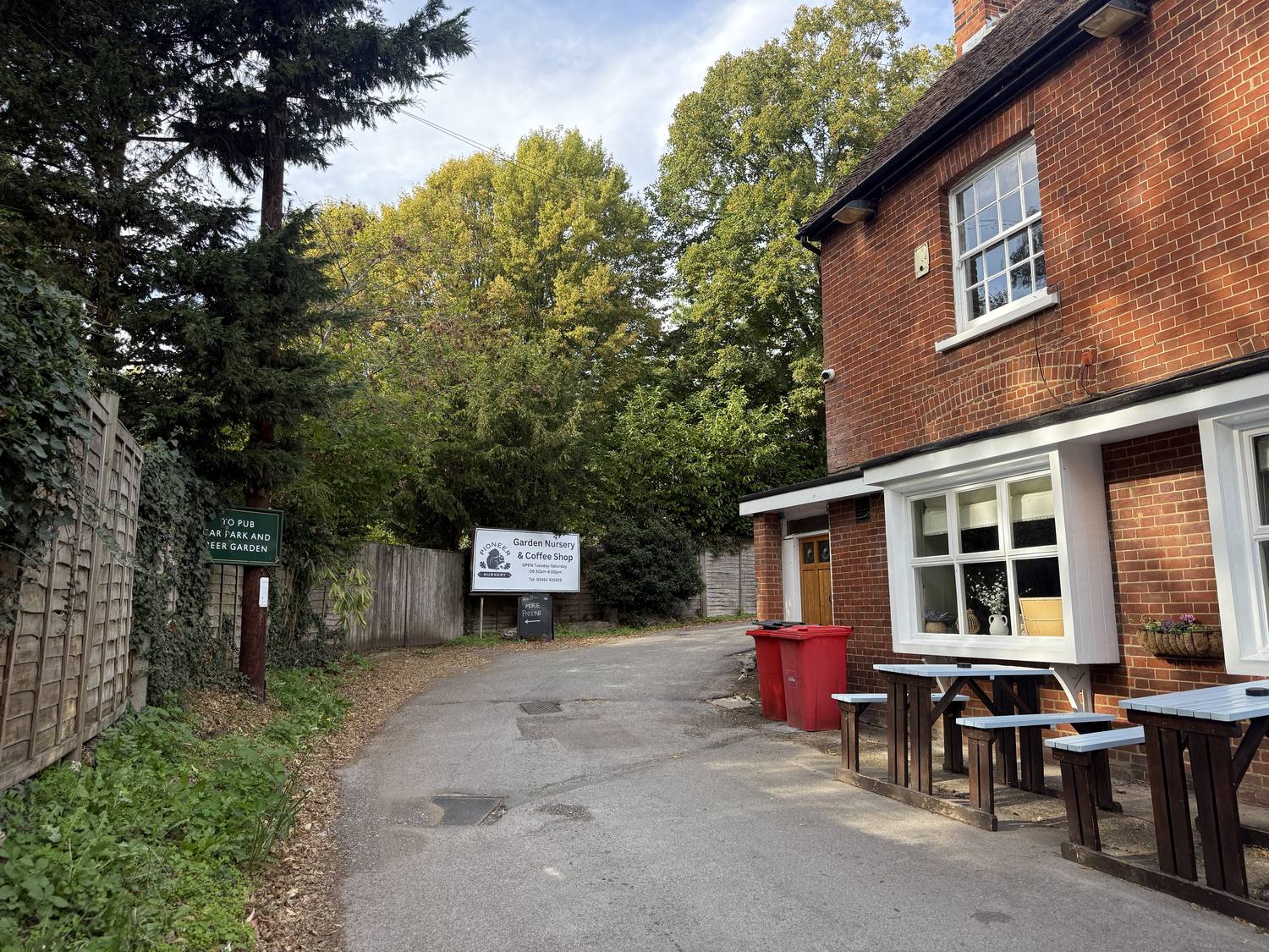 The Three Horseshoes pub on the right, with the lane to the nursery running off to the left